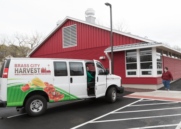 The exterior of the Brass City Regional Food Hub and its delivery van in Waterbury, Connecticut.
